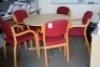 Light oak effect circular meetings table with 5 Bentwood framed Red cloth upholstered meetings chairs (Quality clinic)