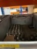 Contents of racking to include various sized tapped plugs and coils - 3