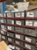 Racking of 22 Metal tote bins containing various heavy duty metal fastenings