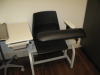 Room D102 Phlebotomy Room; Patient Phlebotomy Chair; Suntech ADC BP/Oxygen/Temp/Pulse Monitor on Stand, Model # not visible; Health-O-Meter Professional Digital Floor Scale, Model #500KL; Wall Art; Stool on wheels