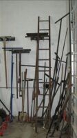 Lot -- shovels, post hole digger, pick, brooms, etc on wall *** PLEASE NOTE: This lot is offered subject to bulk bid offer on lot 118