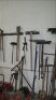 Lot -- shovels, post hole digger, pick, brooms, etc on wall *** PLEASE NOTE: This lot is offered subject to bulk bid offer on lot 118 - 2